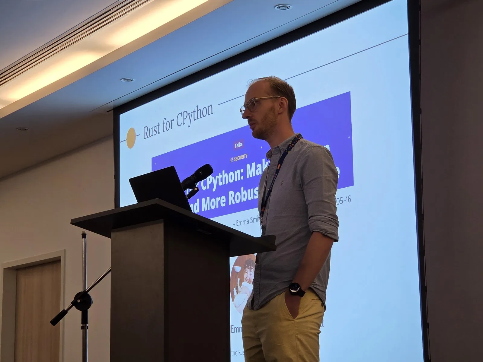 David Hewitt at the lectern, in front of his “Rust for CPython” slide